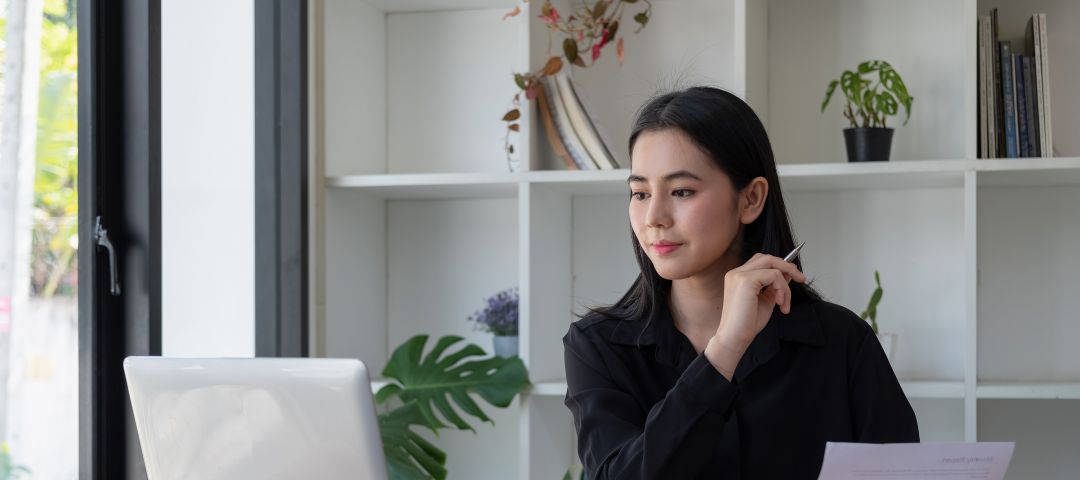 Asian Business Woman at Office Desk