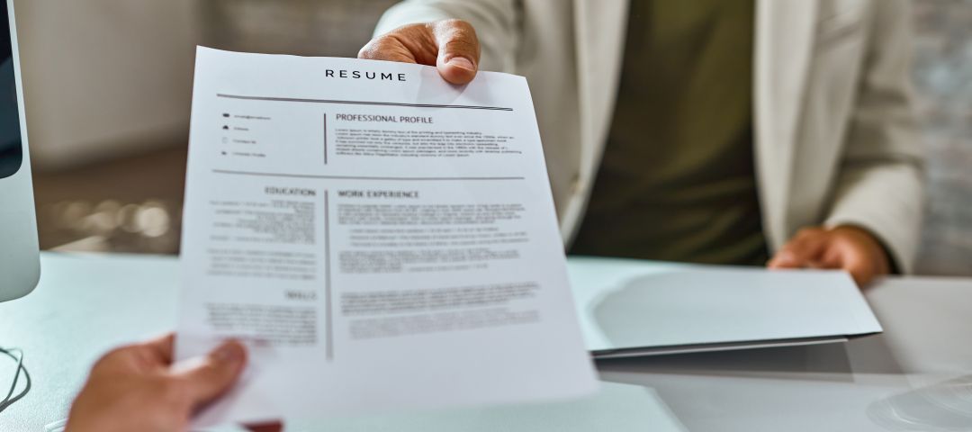 Job Applicant Giving Resume During Job Interview