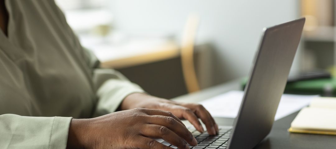 Hands Using a Laptop