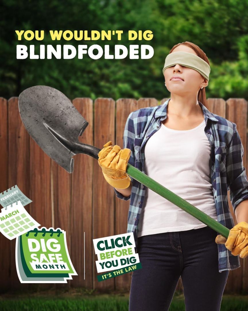 Woman blindfolded and holding a shovel